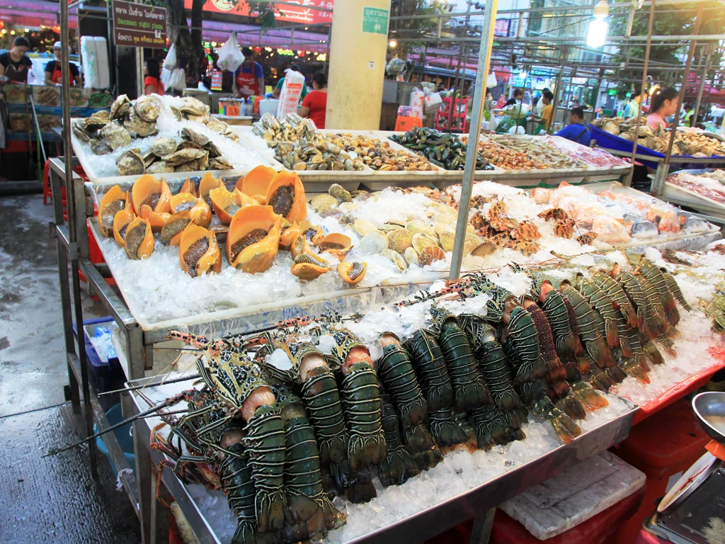Fresh seafood displayed on ice at a fish market in Patong, Thailand